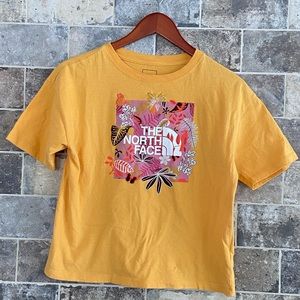 yellow North Face tee